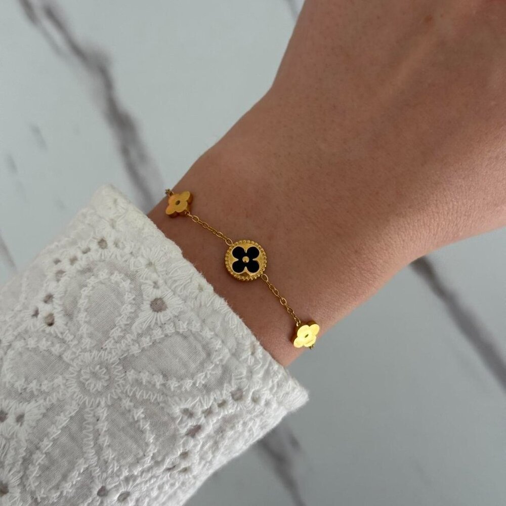 Sku:0373 Gold bracelet black flowers material stainless steel size adjustable